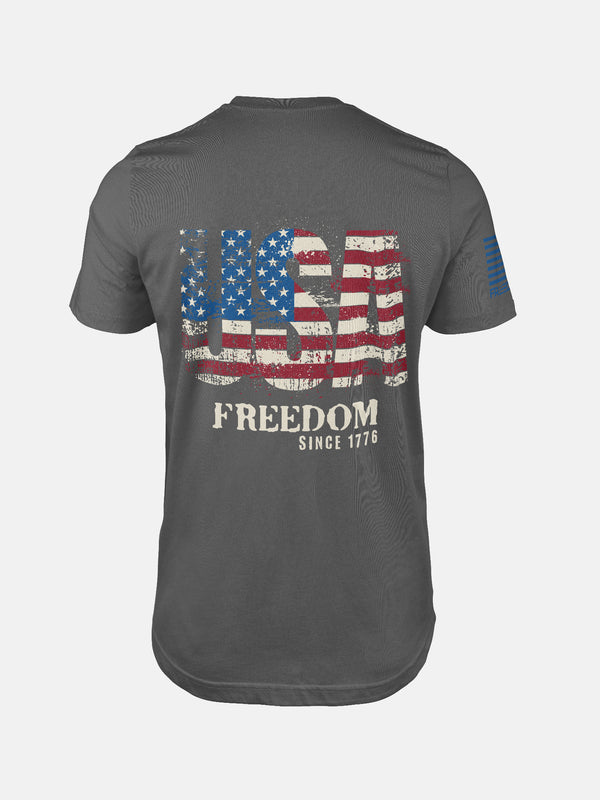Asphalt t-shirt with 'USA Freedom' text and American flag design on a patriotic shirt by FreedomBuilt