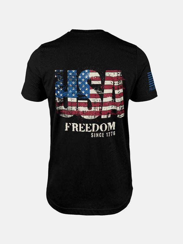 Black t-shirt with 'USA Freedom' text and American flag design on a patriotic shirt by FreedomBuilt